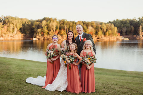 Wedding flowers for the bride and bridal party, featuring coordinated blooms for a cohesive and beautiful look, by Blossom & Bloom Floristry.