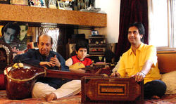3 Generations together in their Music room
