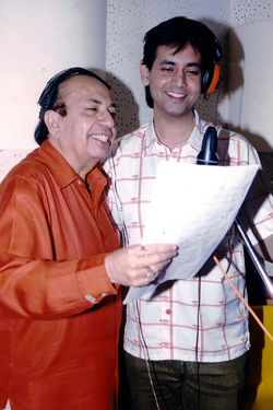 Ruhan recording a song with father