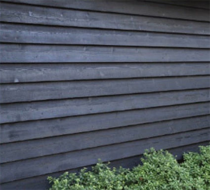 Thumbnail: Black feather edge barn lap board as fence