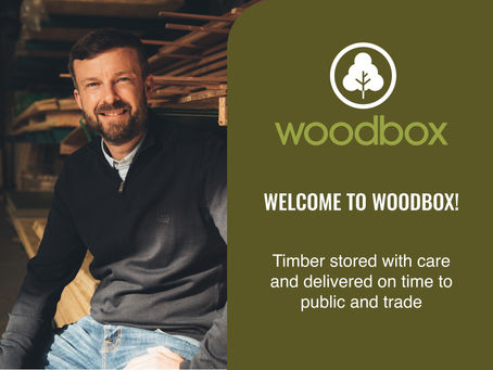 man smiling in timber yard