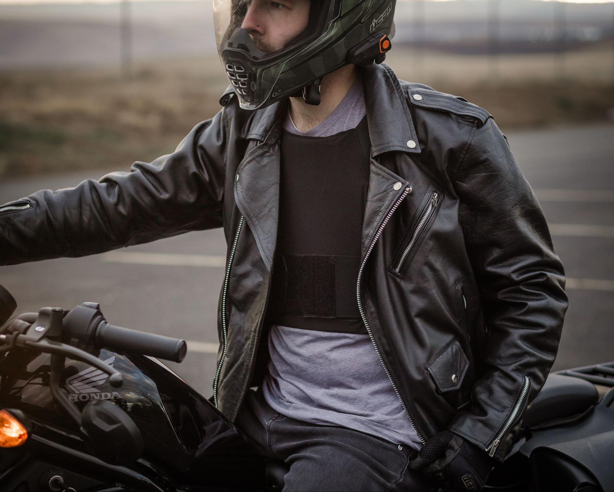 Riding motorcycle with plate carrier