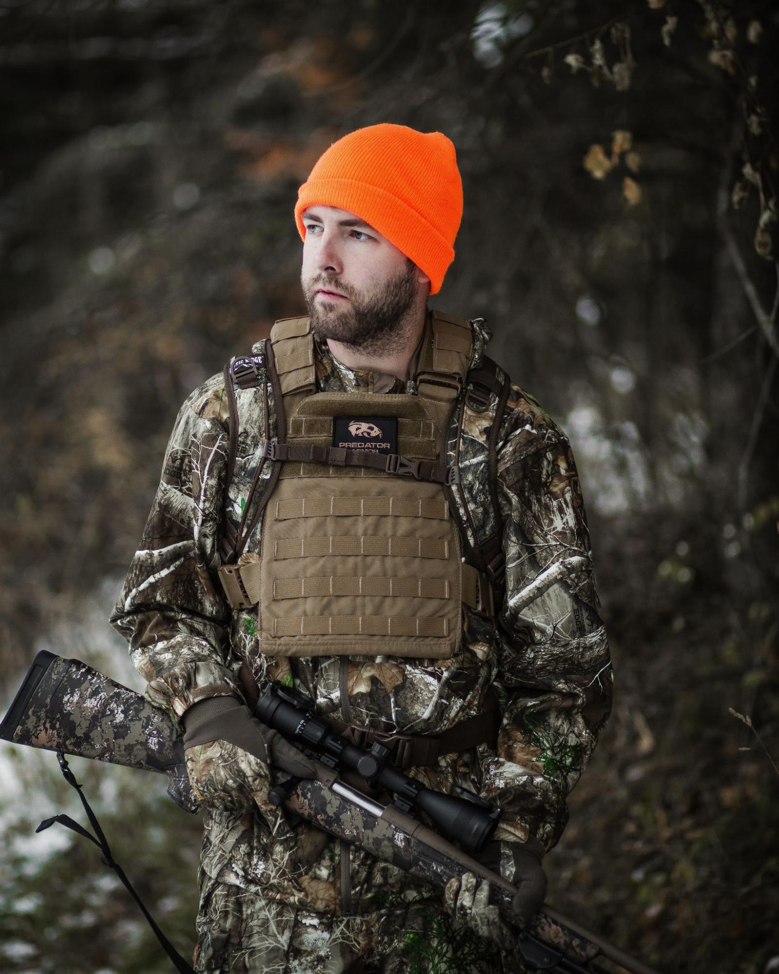 Deer hunter wearing coyote plate carrier and body armor.