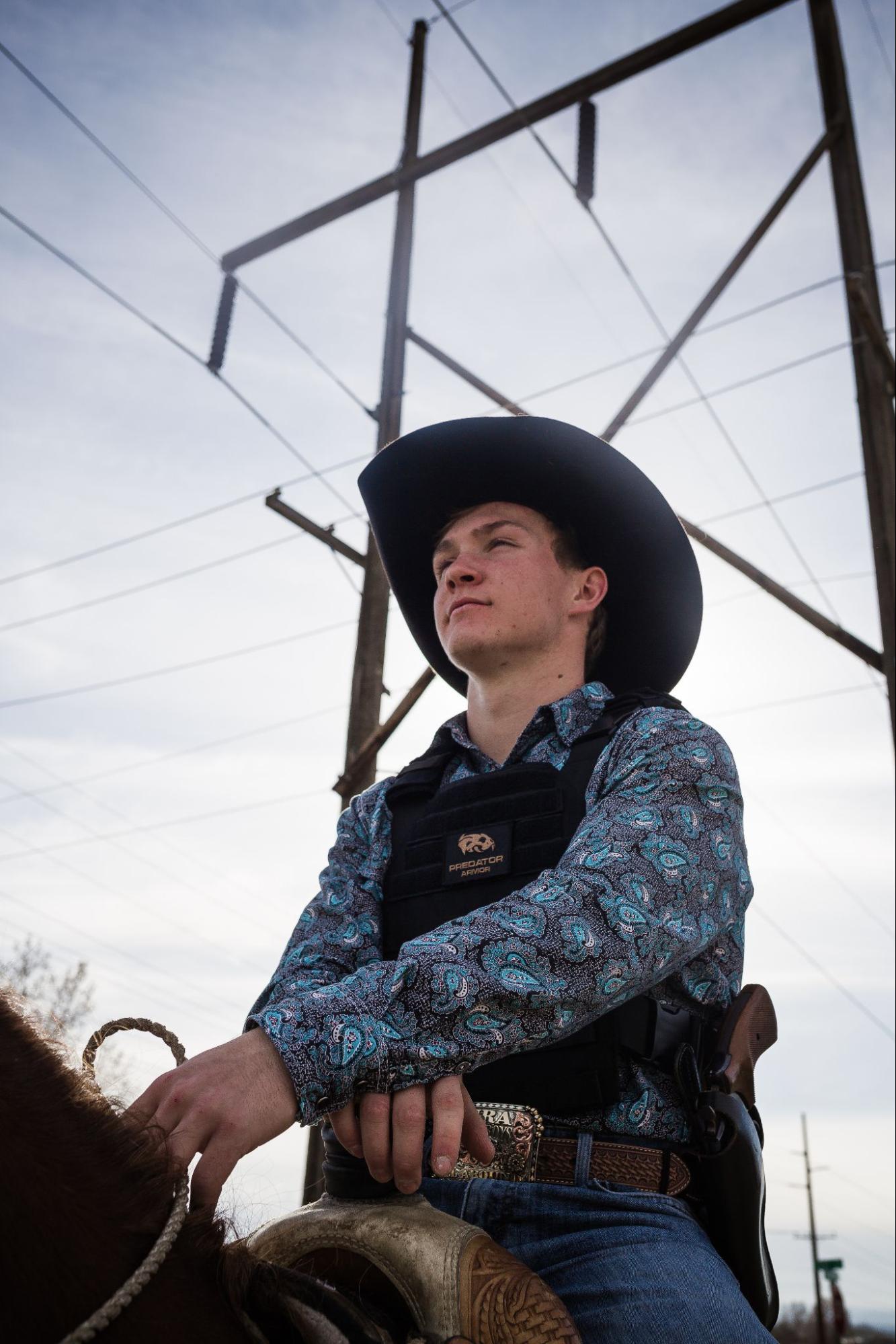 Cowboy wearing plate carrier and body armor