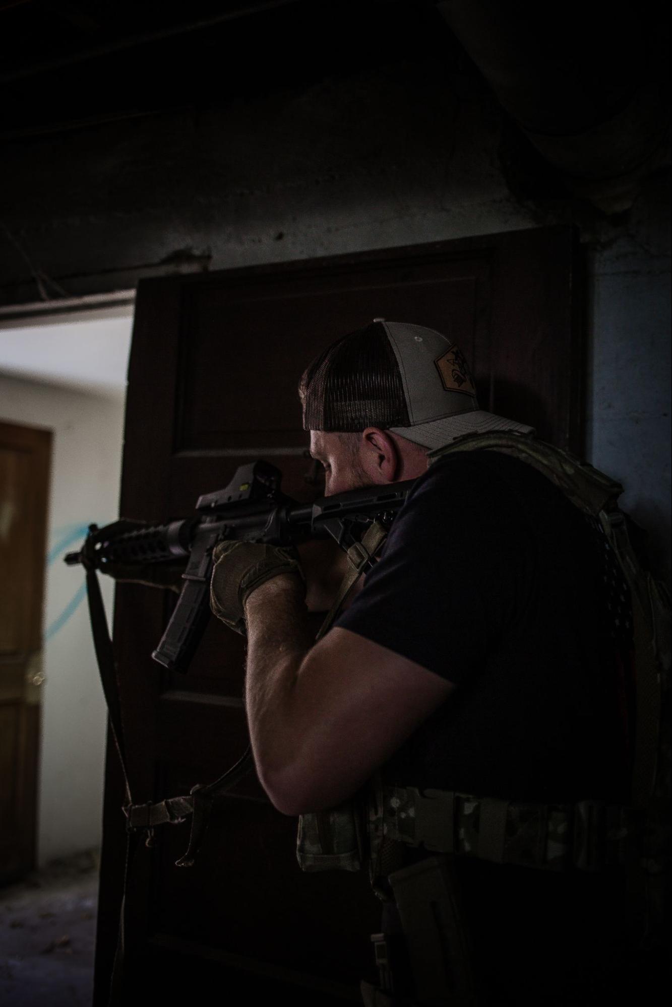 Military operator wearing plate carrier and body armor