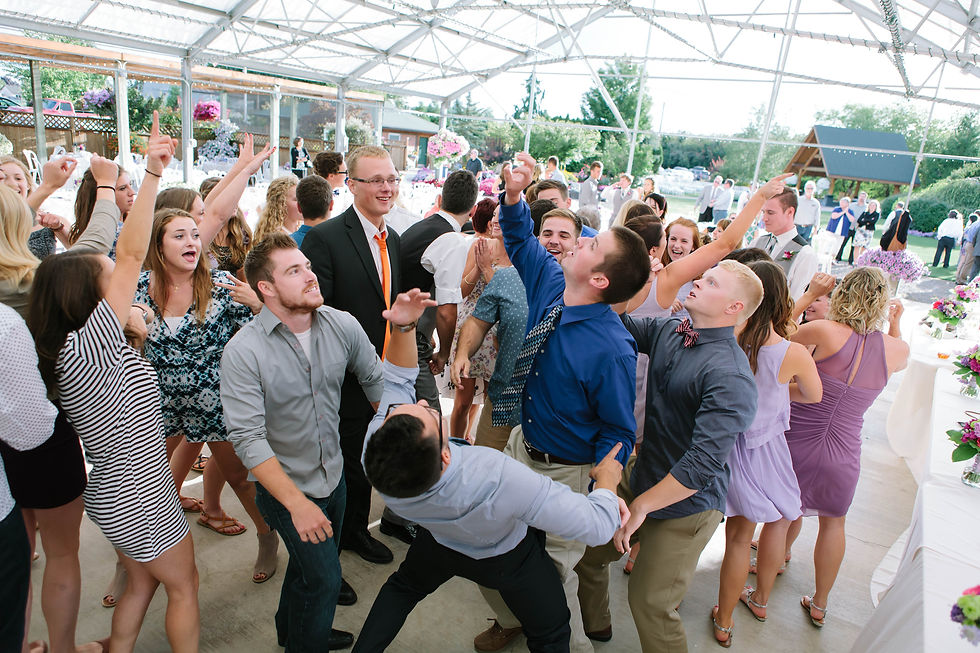 A packed dance floor in the reception area at Log House Garden at Willow Lake