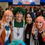 Thumbnail: Group of cosplayers wearing anime and manga character ID cards at a convention