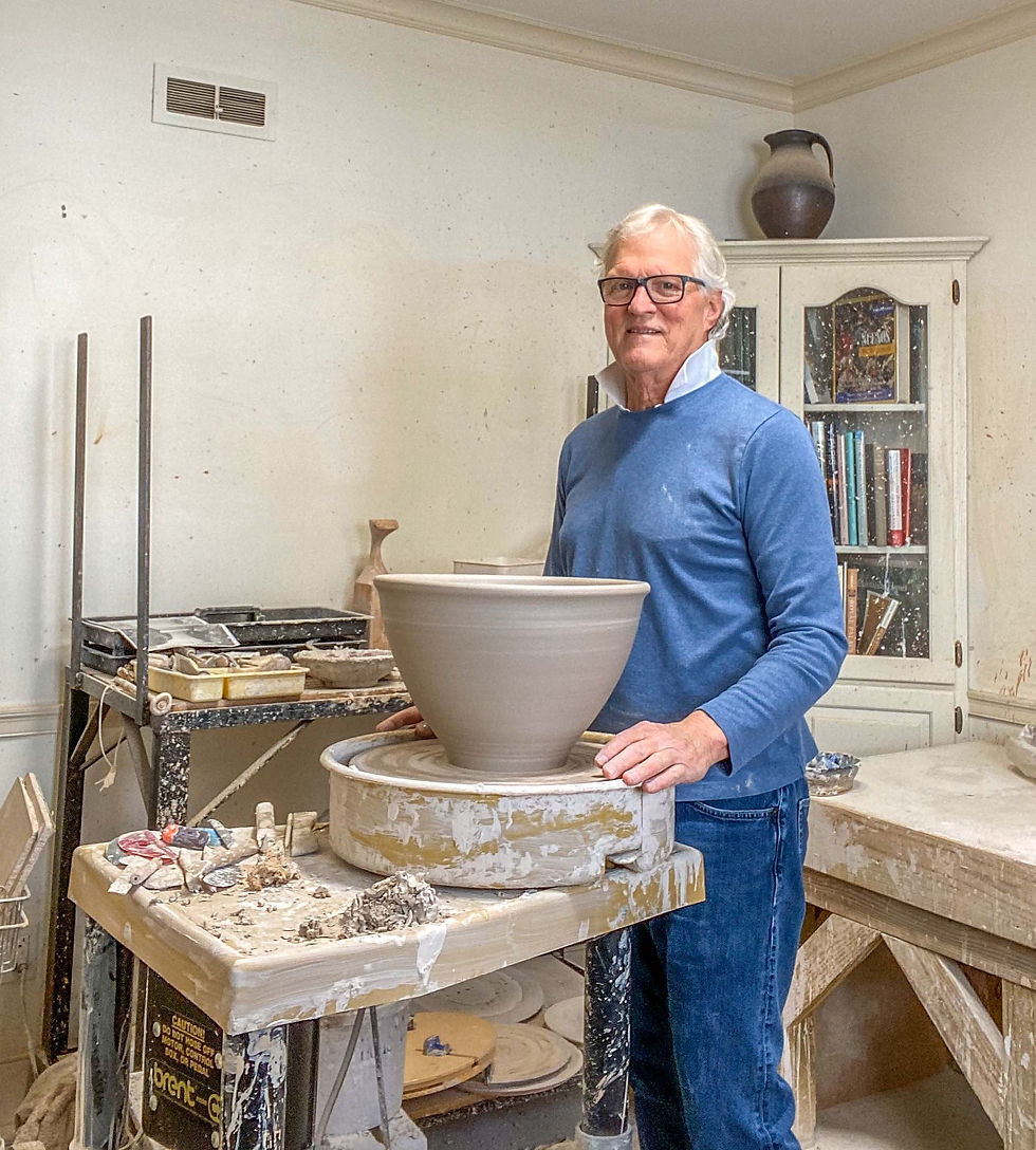 Here I am throwing a big bowl on the potters wheel.