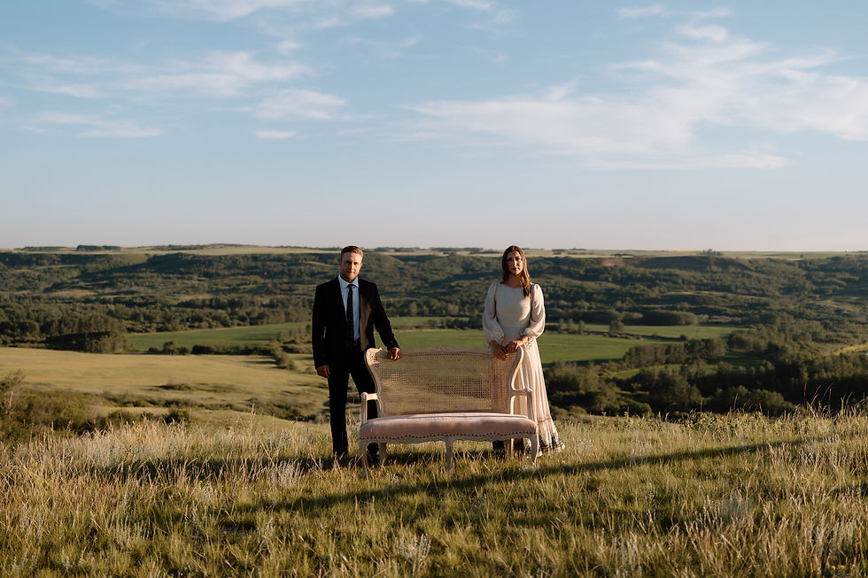 Get inspired by this golden-hour countryside engagement session with vintage flair, personalized props, and romantic aesthetics. Captured by Lloydminster photographer Sarah Thorpe.