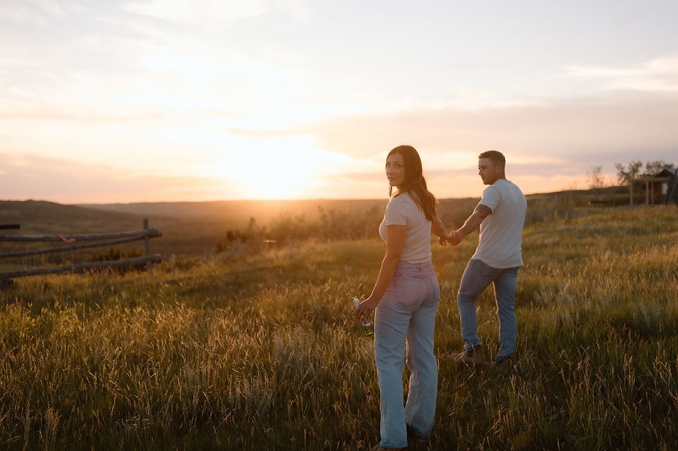 Get inspired by this golden-hour countryside engagement session with vintage flair, personalized props, and romantic aesthetics. Captured by Lloydminster photographer Sarah Thorpe.