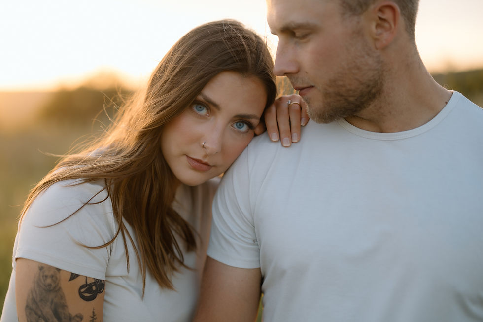 Get inspired by this golden-hour countryside engagement session with vintage flair, personalized props, and romantic aesthetics. Captured by Lloydminster photographer Sarah Thorpe.