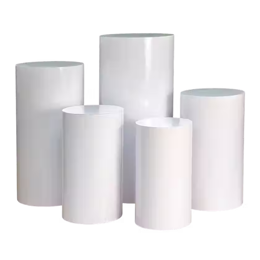 Neutral-toned pedestal display stands styled with florals, available for rent from Oak and Ivory Events in Lloydminster.