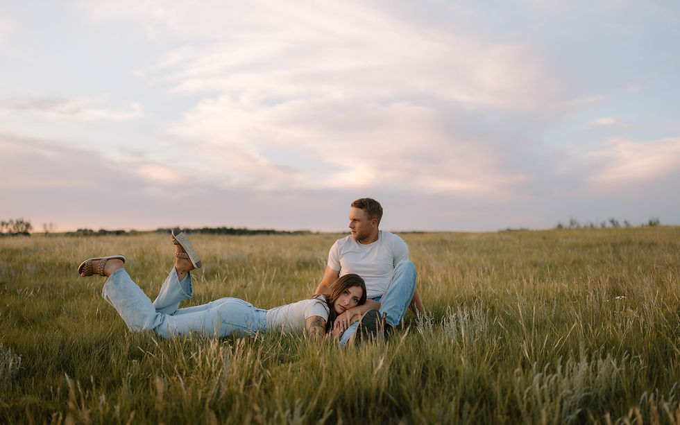 Get inspired by this golden-hour countryside engagement session with vintage flair, personalized props, and romantic aesthetics. Captured by Lloydminster photographer Sarah Thorpe.
