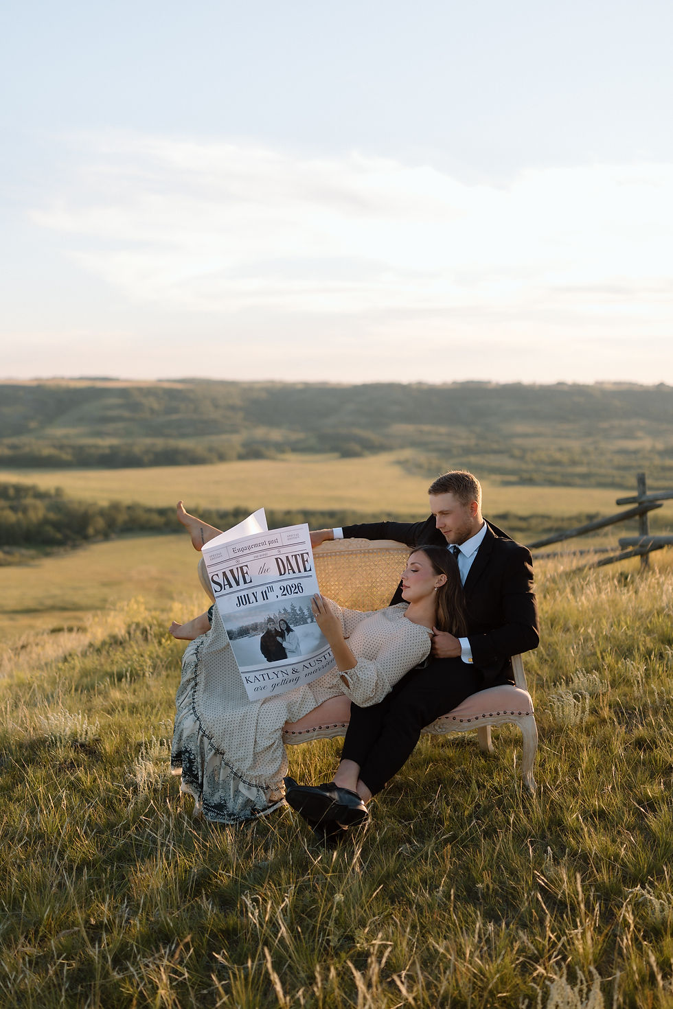Get inspired by this golden-hour countryside engagement session with vintage flair, personalized props, and romantic aesthetics. Captured by Lloydminster photographer Sarah Thorpe.