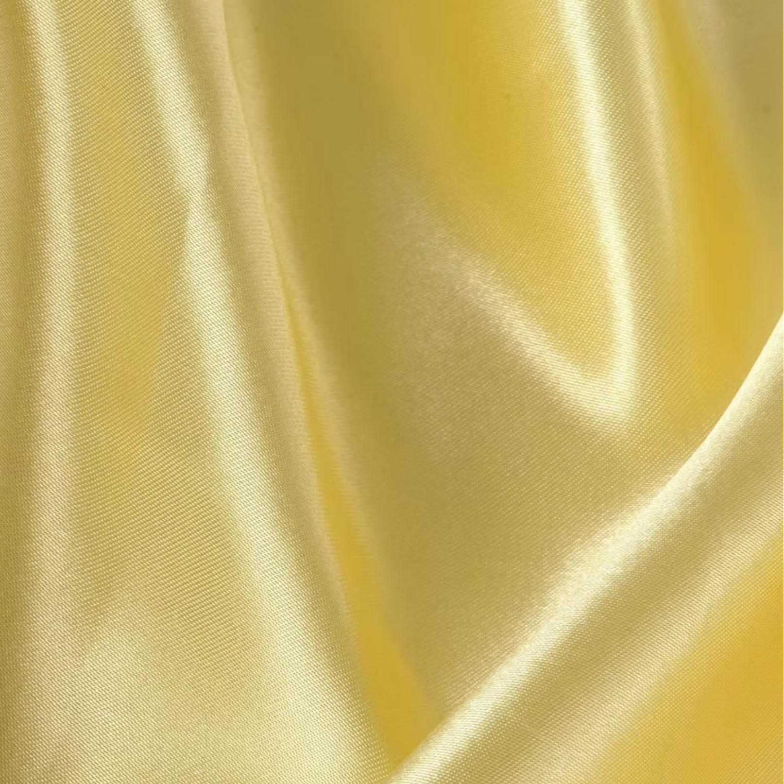 Butter yellow satin napkin rental with glossy finish for modern and elegant wedding table décor.