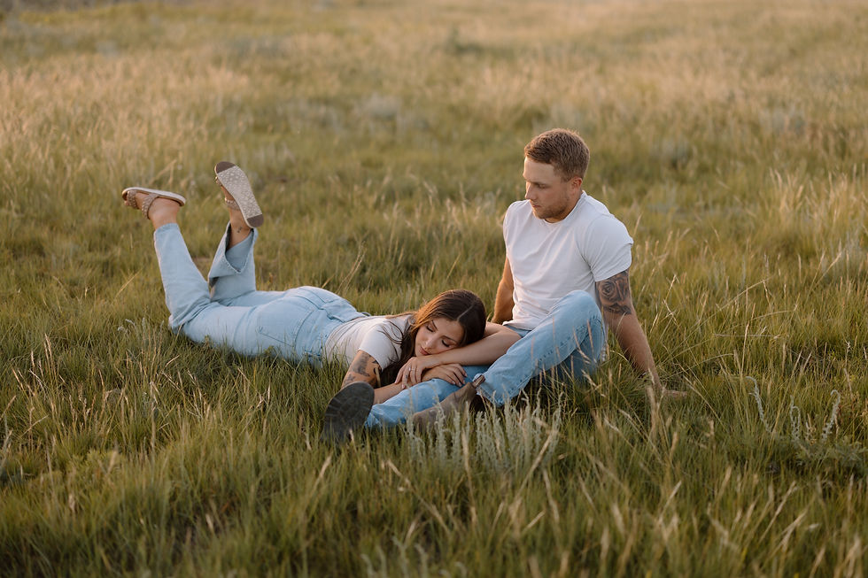 Get inspired by this golden-hour countryside engagement session with vintage flair, personalized props, and romantic aesthetics. Captured by Lloydminster photographer Sarah Thorpe.