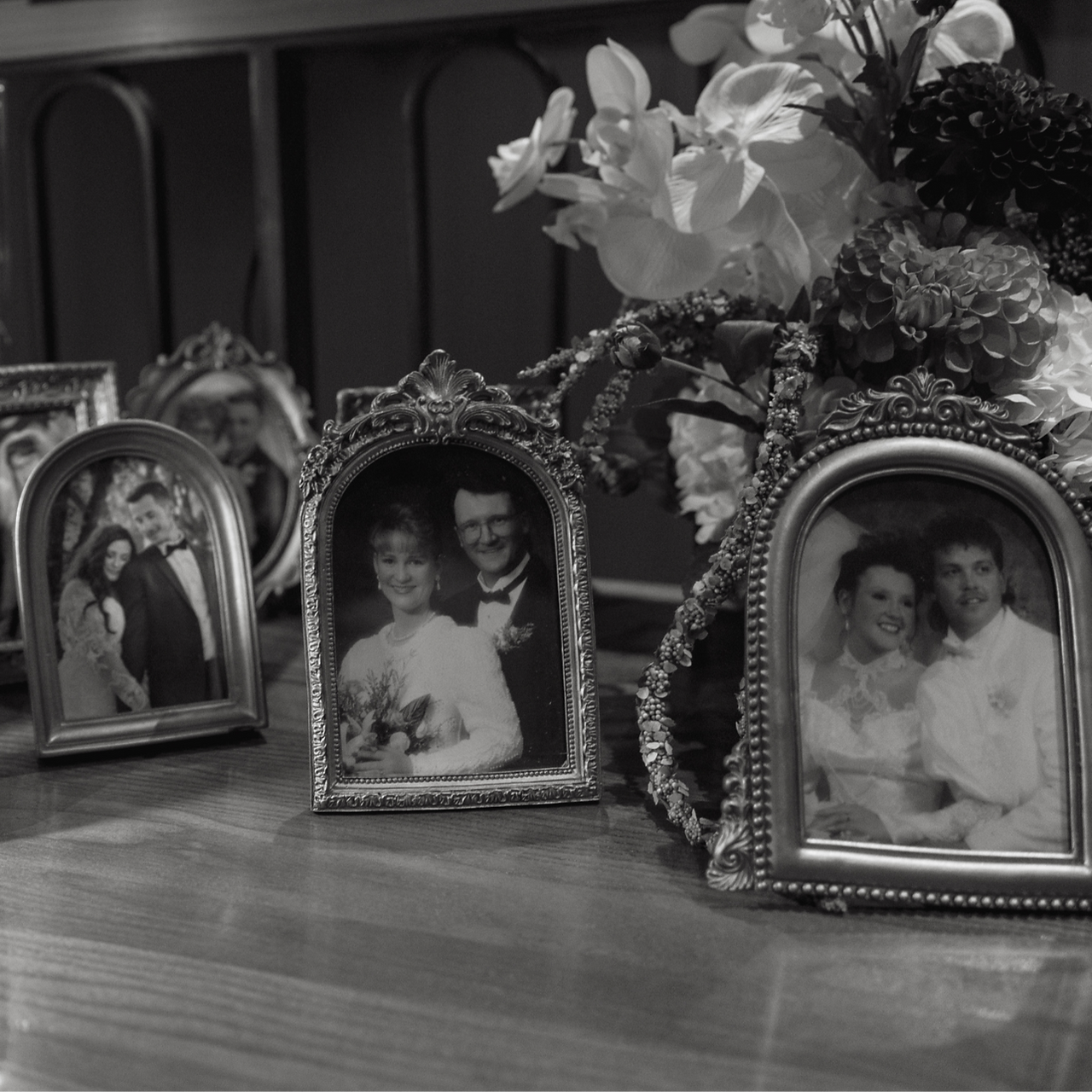 Vintage frames styled at a wedding welcome table