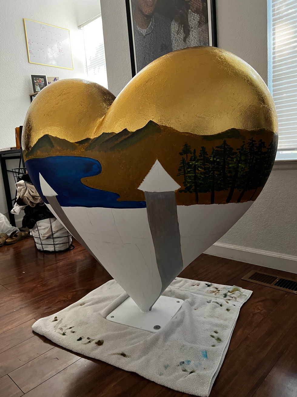 heart sculpture being painted