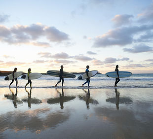 Surfers. shared surf lesson