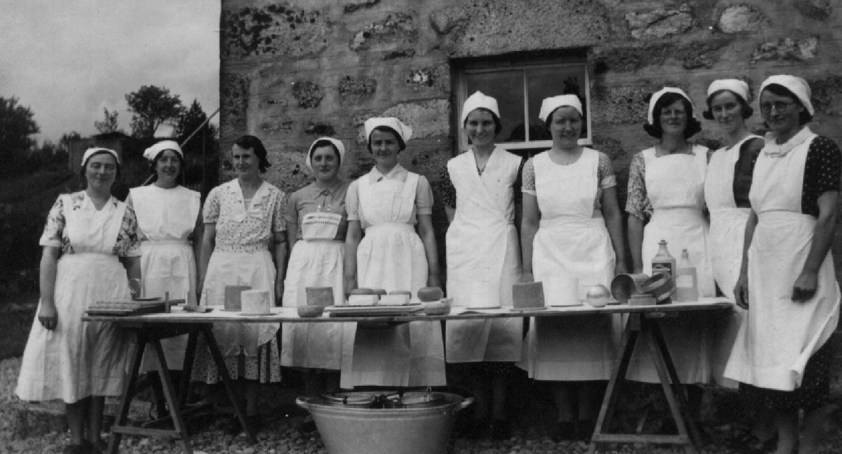 Glen women learning cheesemaking.GIF