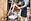 Midsection of man holding chair while st