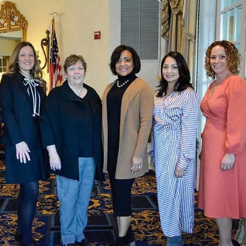 A group of women posing for the camera.