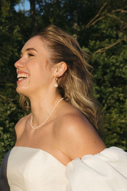 Laughing portrait of a joyful bride during the couple photo session