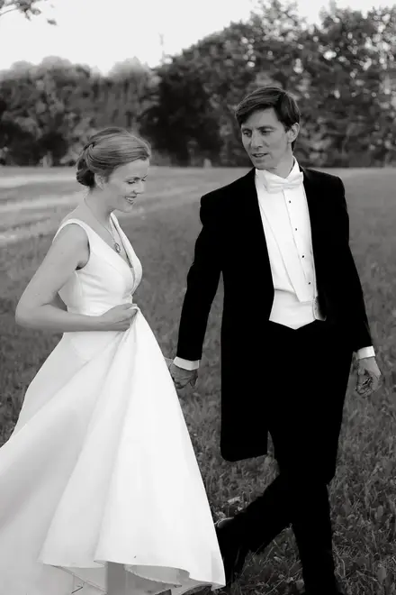 close-up of bride and groom walking in the park