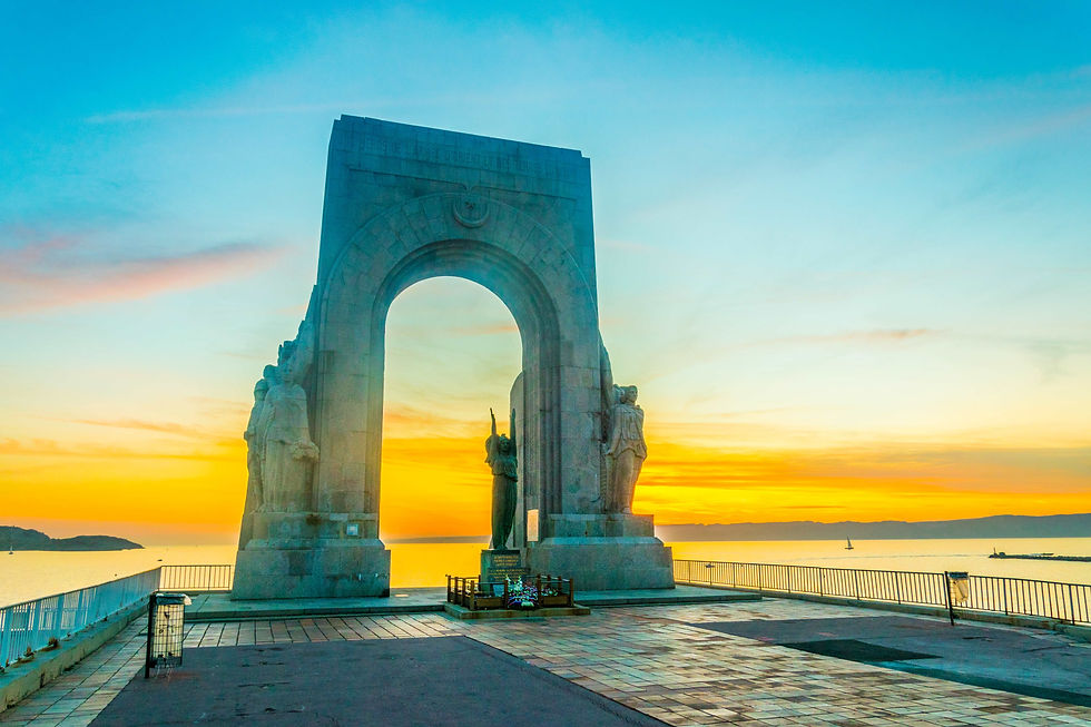 Sunset view la porte de L'orient monument situated at Marseille, France.