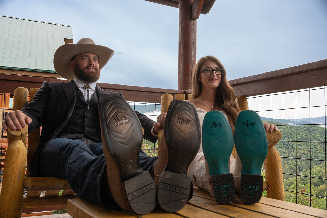 personalized elopement cowboy boots with tennessee mountain backdrop
