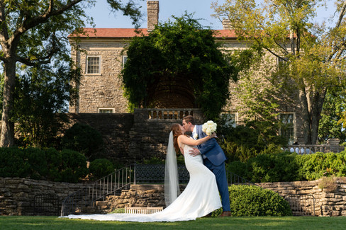 Bride and groom portraits beside front of mansion  Nashville's Cheekwood botanical garden 