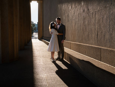 couple elopes at golden hour in nashville's parthenon in cinematic light