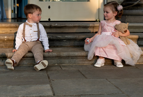 flower girl and ring barer rest after wedding at Nashville's Cheekwood botanical garden 