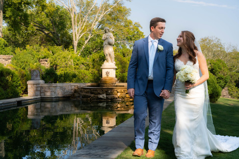 Bride and Groom post wedding at the reflection pool Nashville's Cheekwood botanical garden 