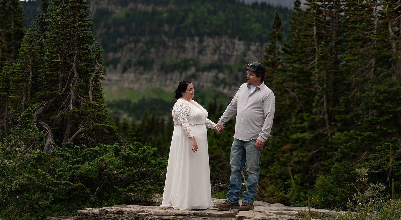 couple explores one of the hikes on the going to the sun road
