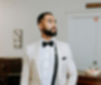 A man wearing a suit with a bowtie in our Cantina & Cigar Lounge