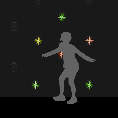 Silhouette of child in dark room interacting with lighting objects
