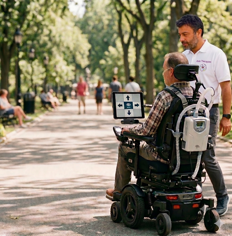Man using eye-gaze to drive his wheelchair in park with therapist assisting beside him