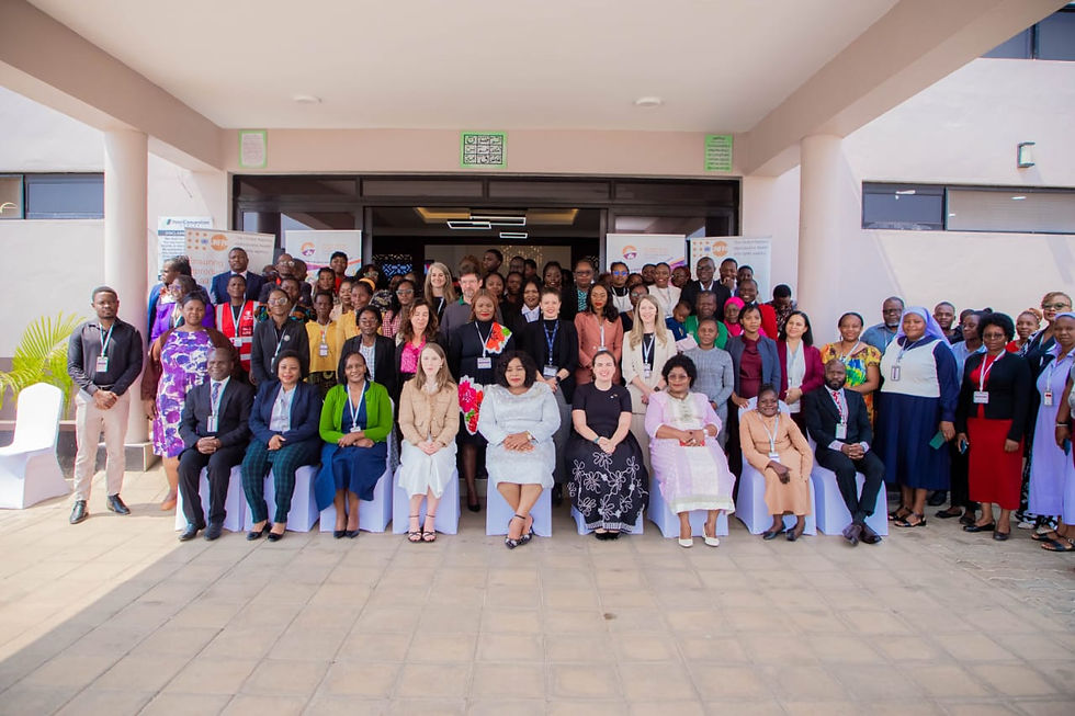 Participants with Hon. Mary Navicha, MP, Minister of Gender, Children, Disability and Social Welfare after the official opening of the symposium.