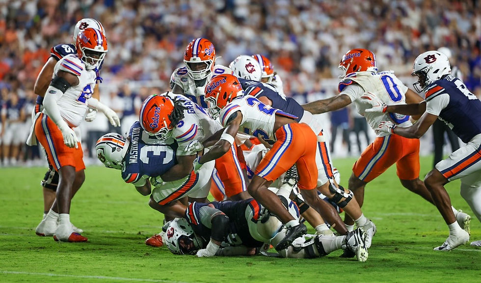 Florida defenders swarm a ball carrier. Photo by Chris Spears, GatorBait Media.