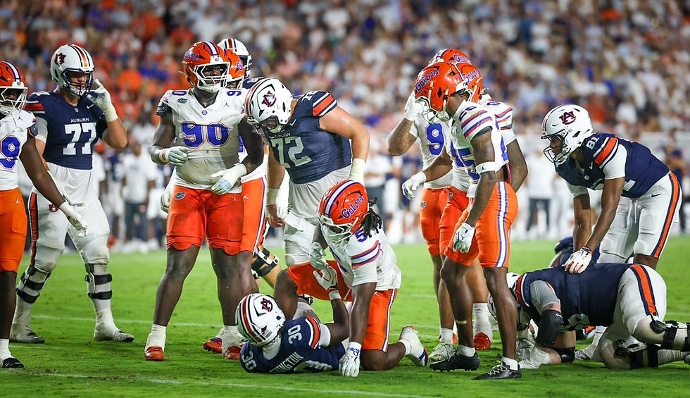 Florida defenders gather after a tackle at Ben Hill Griffin Stadium. Photo by Chris Spears, GatorBait Media.