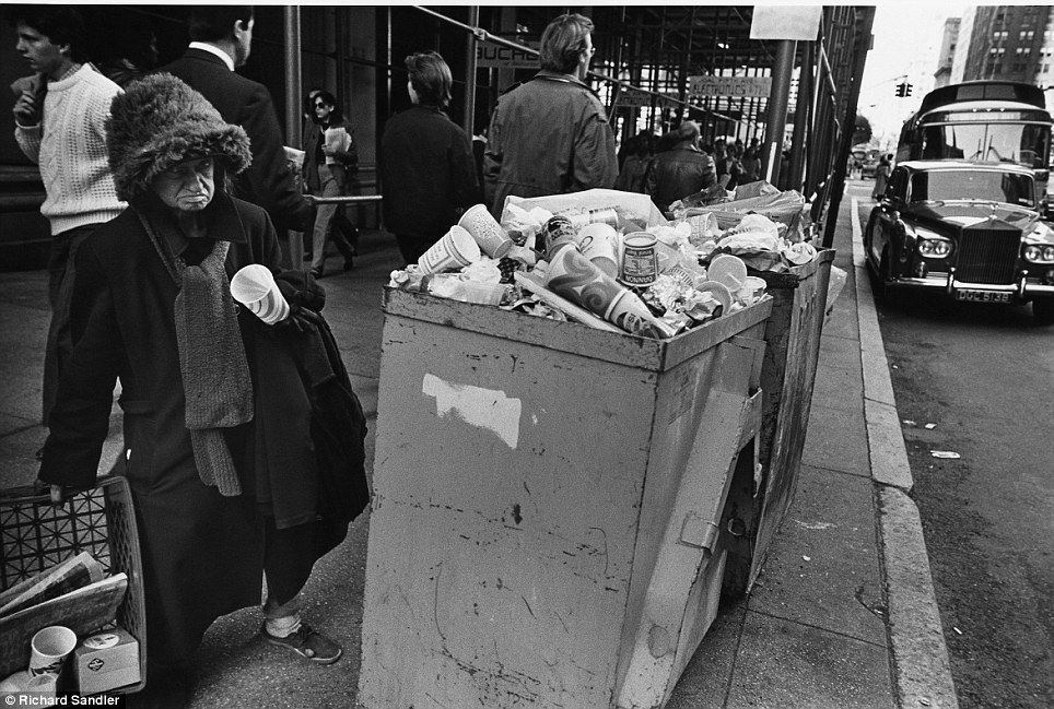 Life on the streets- A homeless woman stands bear overflowing trash on Fifth Ave in 1980