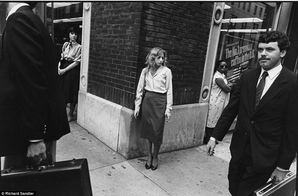 Cigarette break- A woman puffs a cigarette in the days before 'No smoking within 25 feet' signs on M