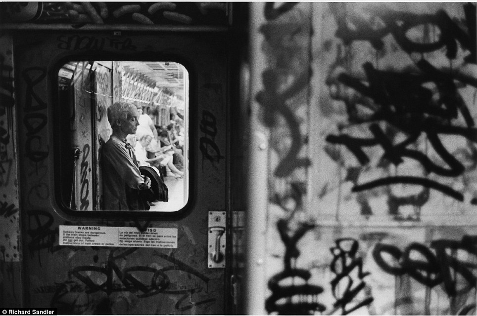 Tunnel vision- A commuter rides the subway, oblivious to the moment being captured on film in 1983 b
