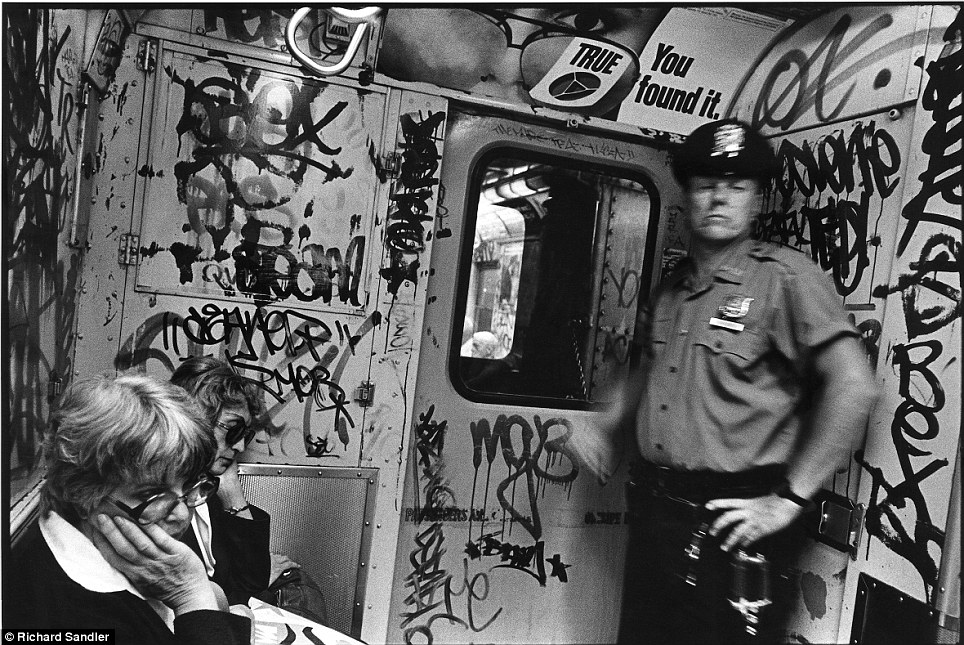 Snapped- A police officer is caught mid-movement by Sandler in this shot called 'True You Found it' 