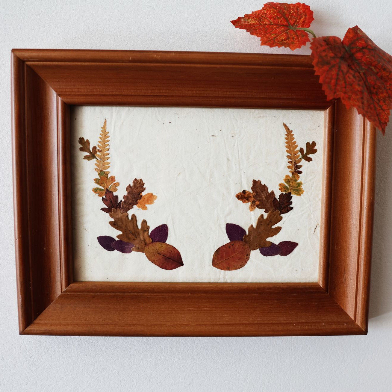Shop The Bellow frame representing stag antlers with real pressed leaves