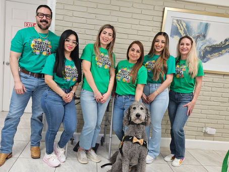 Vitality Family Medical Group Team with critical incident canine Chappie on Mental Health Awareness Day