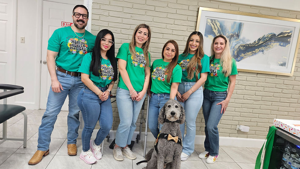 Vitality Family Medical Group Team with critical incident canine Chappie on Mental Health Awareness Day