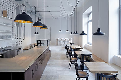 Kitchen interior setup with a bar and tables