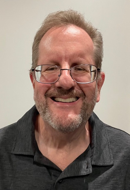 smiling man with glasses